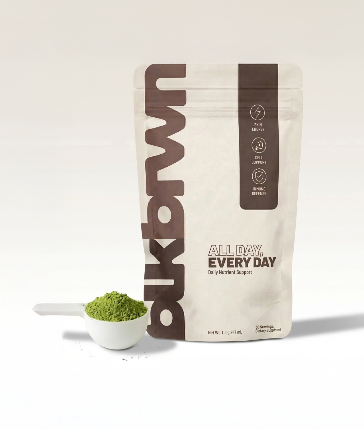A woman rests her head on her hand, posing behind a white pouch of blkbrwn supplement.